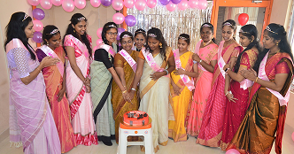 Women of Piccosoft wearing sashes during Women's Day celebration